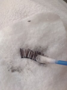 cleaning false eyelashes on a cottom pad